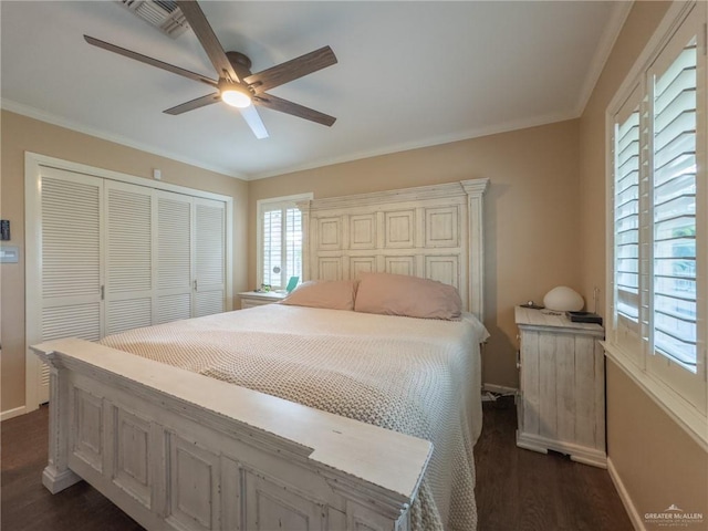 bedroom with multiple windows, ceiling fan, crown molding, and dark hardwood / wood-style floors