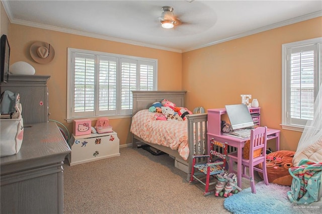 carpeted bedroom featuring ceiling fan and ornamental molding