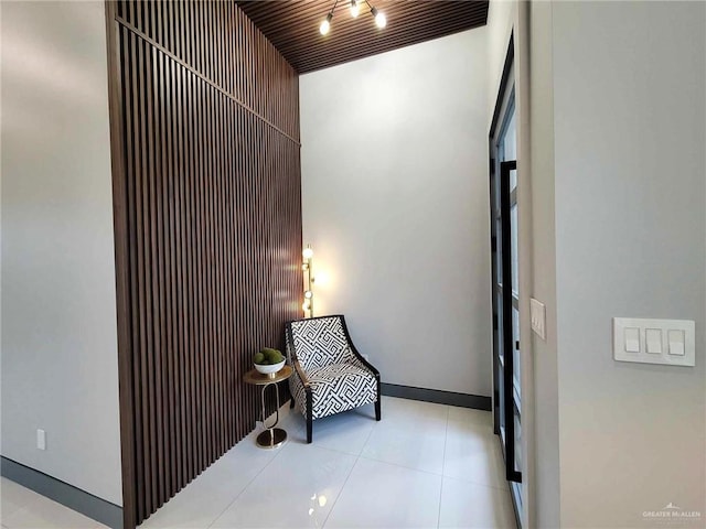 sitting room with a towering ceiling