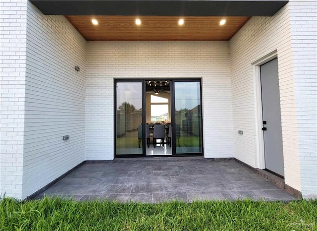 property entrance with a patio