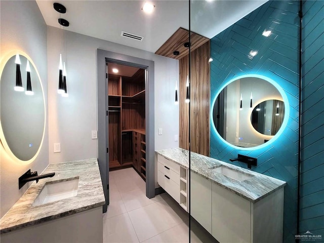 bathroom with tile patterned flooring and vanity