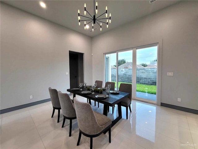 tiled dining room with an inviting chandelier