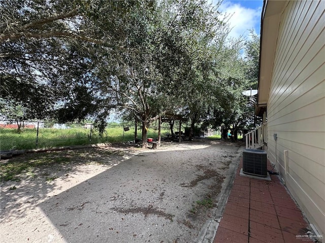 view of yard featuring central AC unit, a patio area, and a gazebo