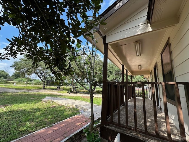 exterior space with a yard and covered porch