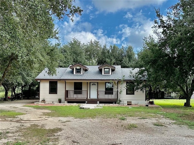 view of front of property with a front yard and a porch