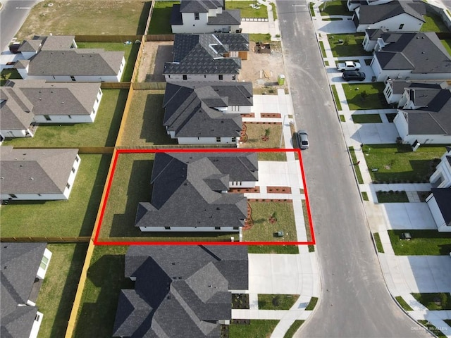 birds eye view of property with a residential view