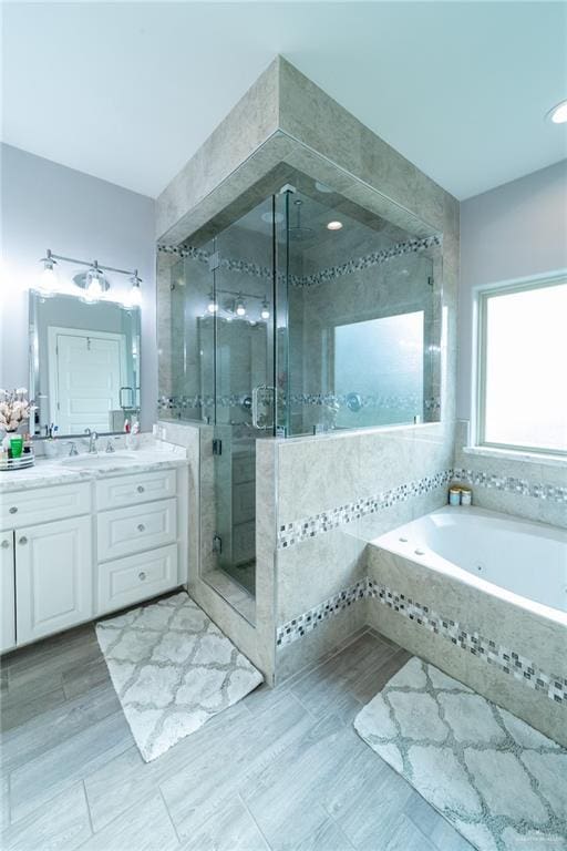 816 Samaria St, Weslaco, TX 78596 - full bathroom featuring vanity, a stall shower, and a garden tub