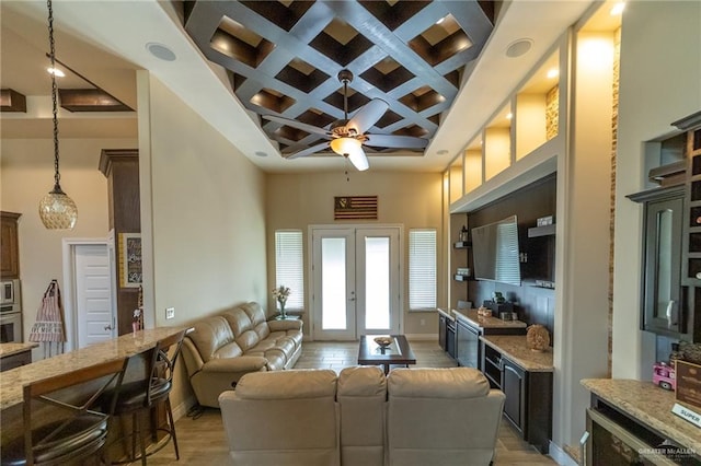 816 Samaria St, Weslaco, TX 78596 - living room featuring coffered ceiling, a towering ceiling, ceiling fan, beamed ceiling, and light wood-style floors