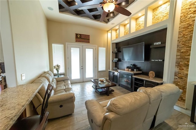 816 Samaria St, Weslaco, TX 78596 - living area featuring coffered ceiling, french doors, ceiling fan, a towering ceiling, and a bar