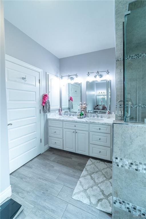 816 Samaria St, Weslaco, TX 78596 - full bathroom featuring a stall shower and double vanity