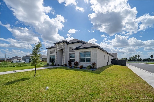 view of front of home featuring a front lawn