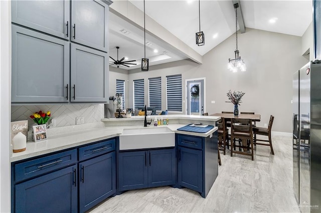 kitchen with beam ceiling, sink, stainless steel refrigerator with ice dispenser, kitchen peninsula, and decorative light fixtures