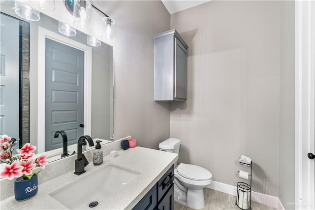 bathroom with hardwood / wood-style flooring, vanity, and toilet