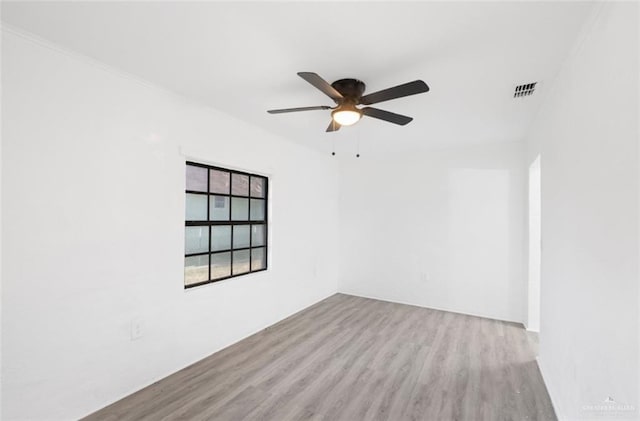 unfurnished room with ceiling fan and light hardwood / wood-style floors