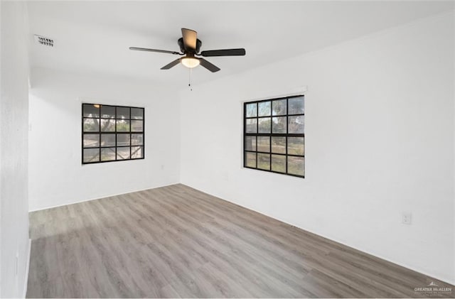 spare room featuring ceiling fan and light wood-type flooring