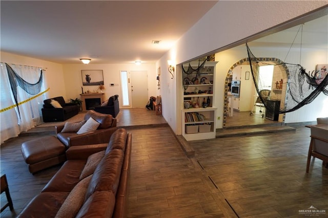 living room featuring dark wood-type flooring