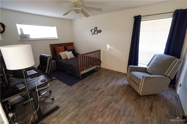 bedroom featuring ceiling fan and dark hardwood / wood-style flooring