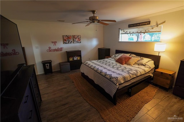 bedroom featuring hardwood / wood-style floors, ceiling fan, and crown molding