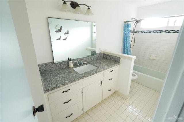 full bathroom with tile patterned flooring, vanity, toilet, and tiled shower / bath combo