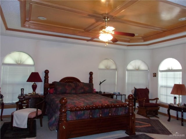 bedroom featuring carpet flooring, ceiling fan, a raised ceiling, and crown molding