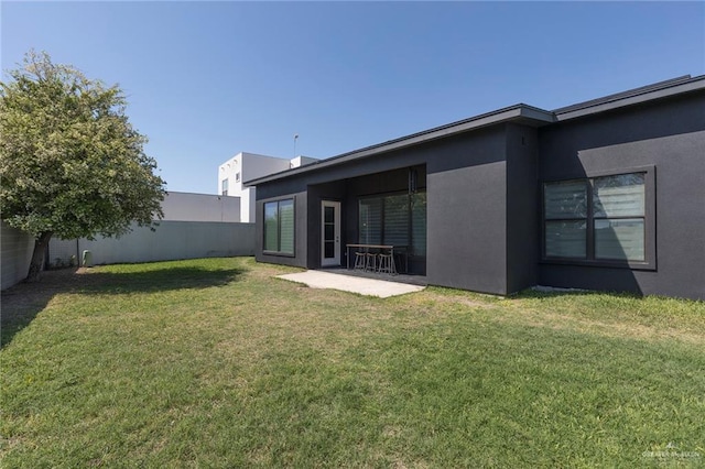 view of yard with a patio and a fenced backyard