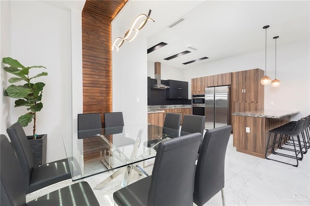 dining room with visible vents and marble finish floor