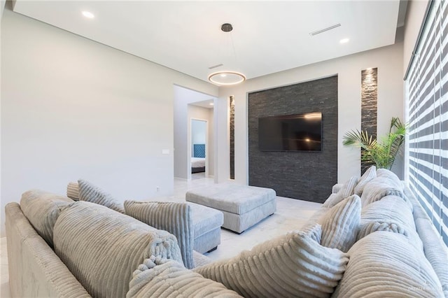 living room featuring recessed lighting and visible vents