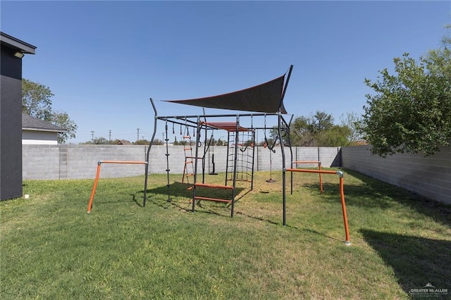 view of play area with a yard and a fenced backyard