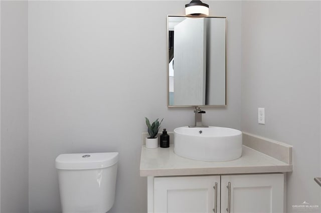 half bath with vanity and toilet