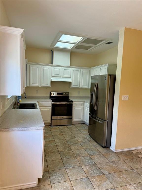 2100 Emory Ave, Mcallen, TX 78504 - kitchen featuring baseboards, appliances with stainless steel finishes, light countertops, a sink, and white cabinetry