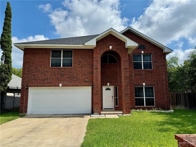 2100 Emory Ave, Mcallen, TX 78504 - traditional-style home with a front lawn, driveway, brick siding, an attached garage, and fence