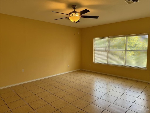 2100 Emory Ave, Mcallen, TX 78504 - spare room featuring light tile patterned floors, ceiling fan, baseboards, and visible vents