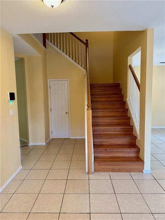 2100 Emory Ave, Mcallen, TX 78504 - stairway featuring tile patterned floors and baseboards