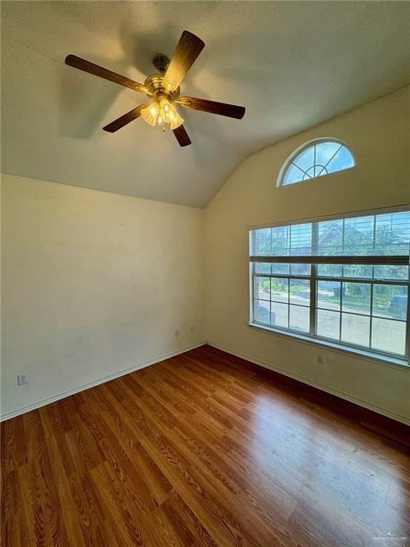 2100 Emory Ave, Mcallen, TX 78504 - empty room featuring baseboards, wood finished floors, ceiling fan, and vaulted ceiling
