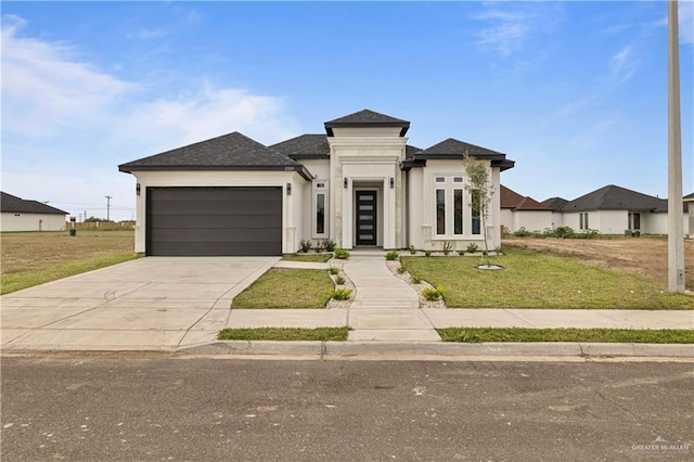 view of front of home with a garage and a front yard