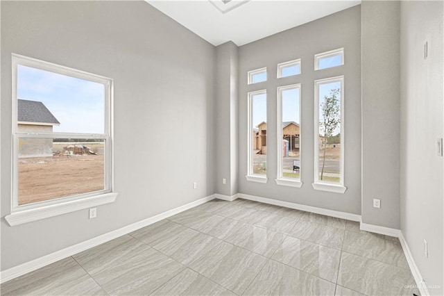 unfurnished room with a wealth of natural light