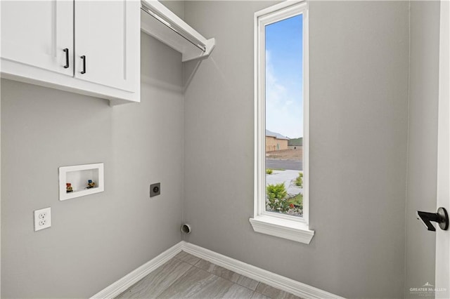 laundry room featuring washer hookup, cabinets, and hookup for an electric dryer