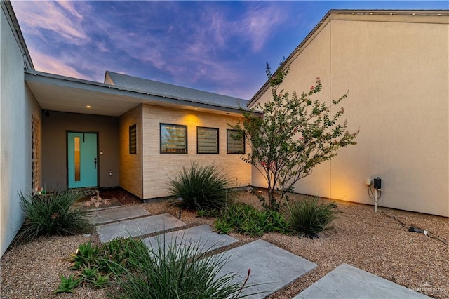 2411 Holland Ave, Edinburg, TX 78539 - exterior entry at dusk featuring stucco siding