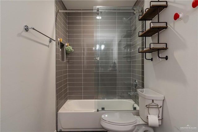 2411 Holland Ave, Edinburg, TX 78539 - full bathroom featuring toilet and shower / bath combination with glass door