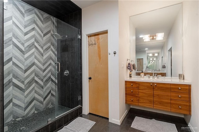 2411 Holland Ave, Edinburg, TX 78539 - bathroom featuring a stall shower, vanity, and baseboards