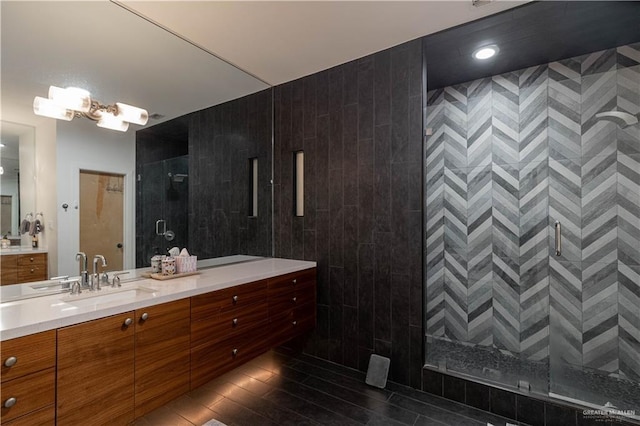 2411 Holland Ave, Edinburg, TX 78539 - bathroom with a shower stall, vanity, and wood finished floors