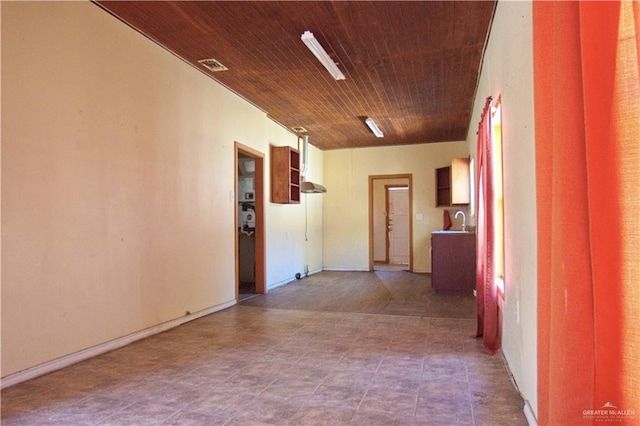 corridor with visible vents and wooden ceiling