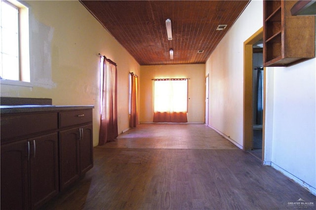 hall featuring visible vents, wood finished floors, and wooden ceiling