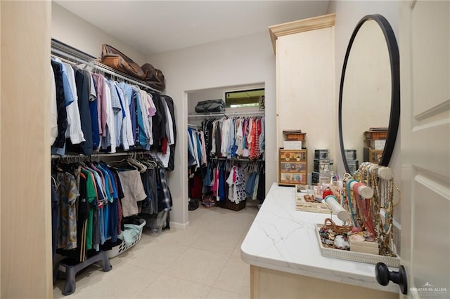 spacious closet featuring light tile patterned flooring