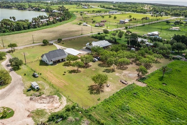 drone / aerial view featuring a water view and a rural view