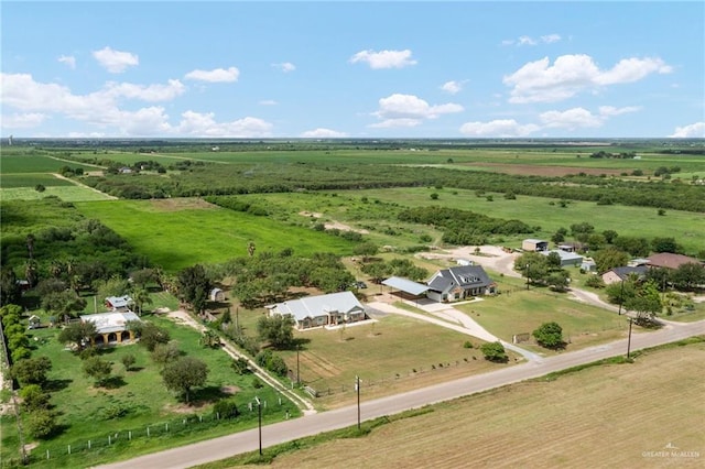 birds eye view of property with a rural view