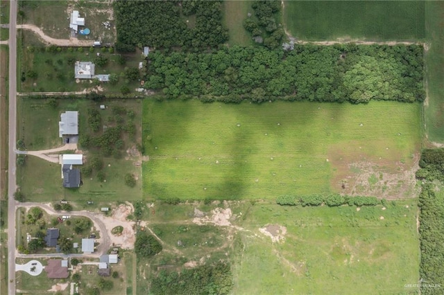 birds eye view of property with a rural view and a water view