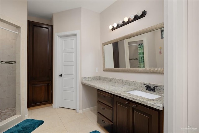 bathroom featuring tile patterned floors, a shower with curtain, and vanity