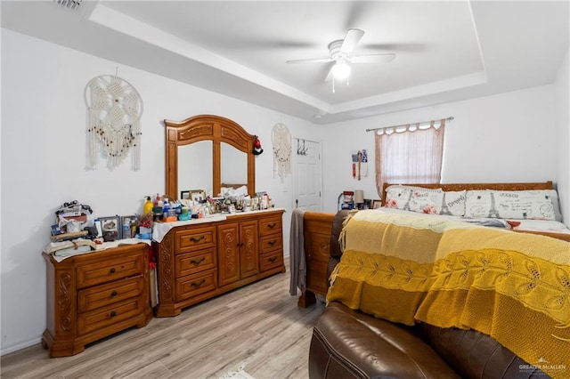 1600 Pullin Ave, San Juan, TX 78589 - bedroom with a raised ceiling, light wood-style flooring, and ceiling fan