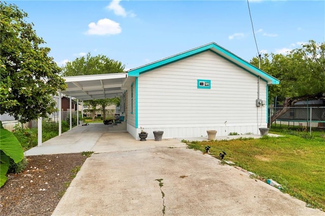 1600 Pullin Ave, San Juan, TX 78589 - view of property exterior featuring concrete driveway and an attached carport